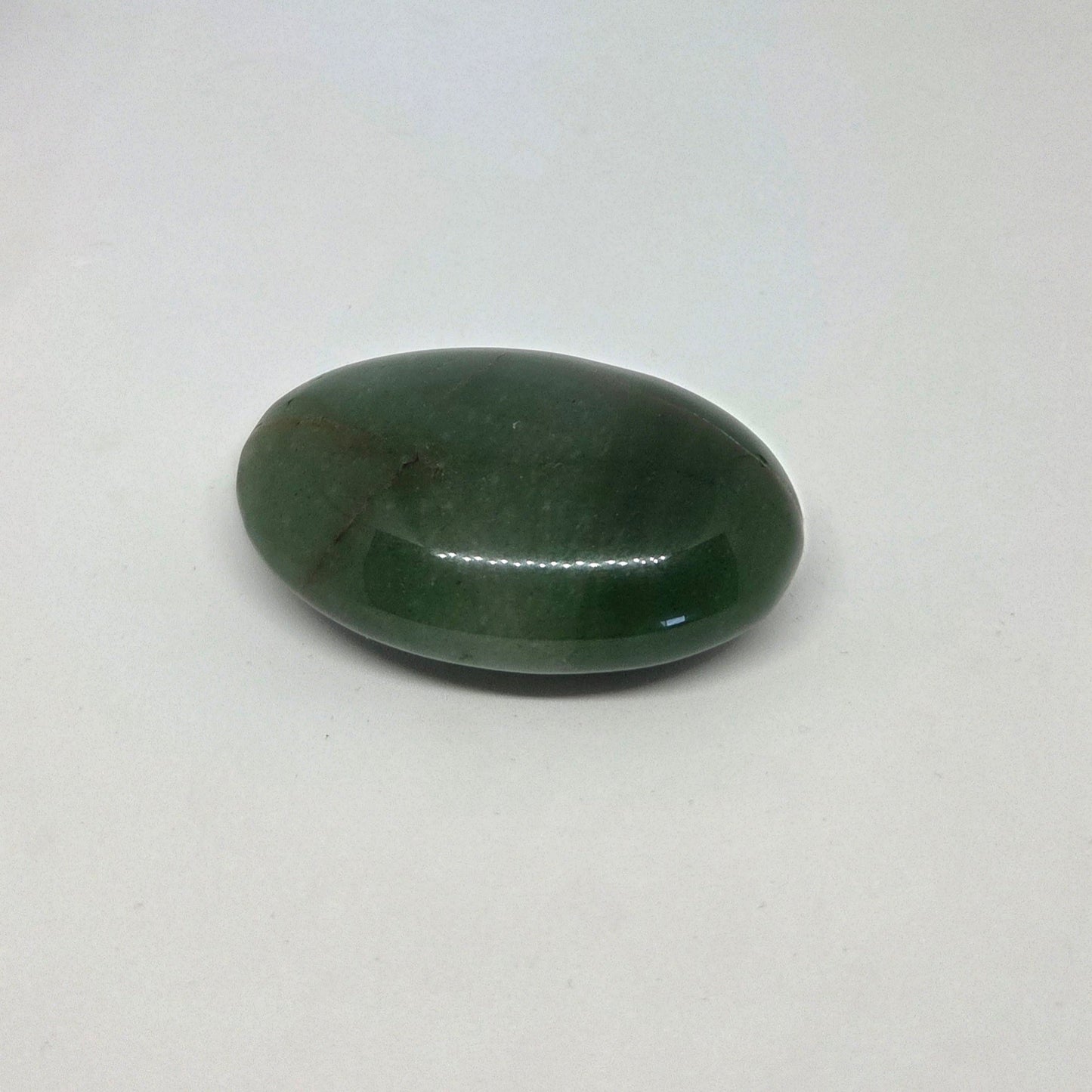 Green stone on a white background