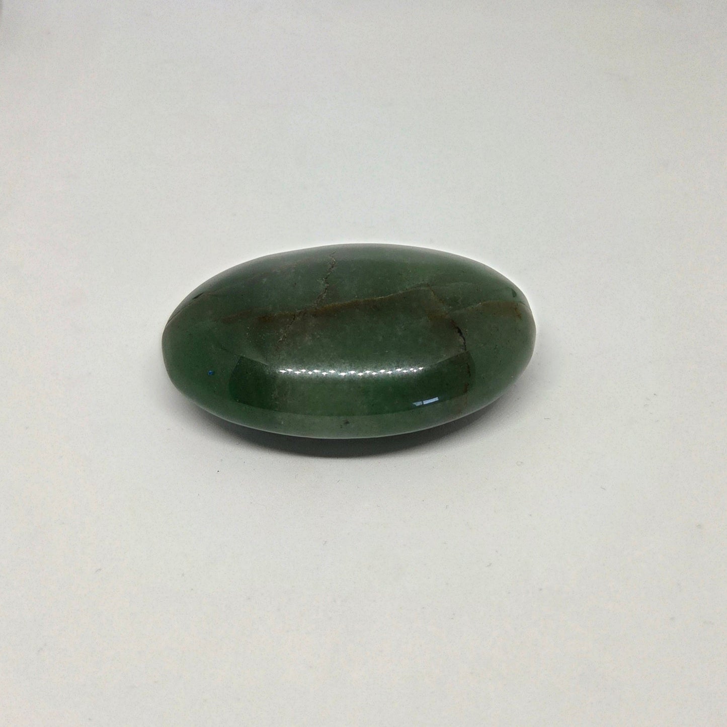 Green stone on a white background