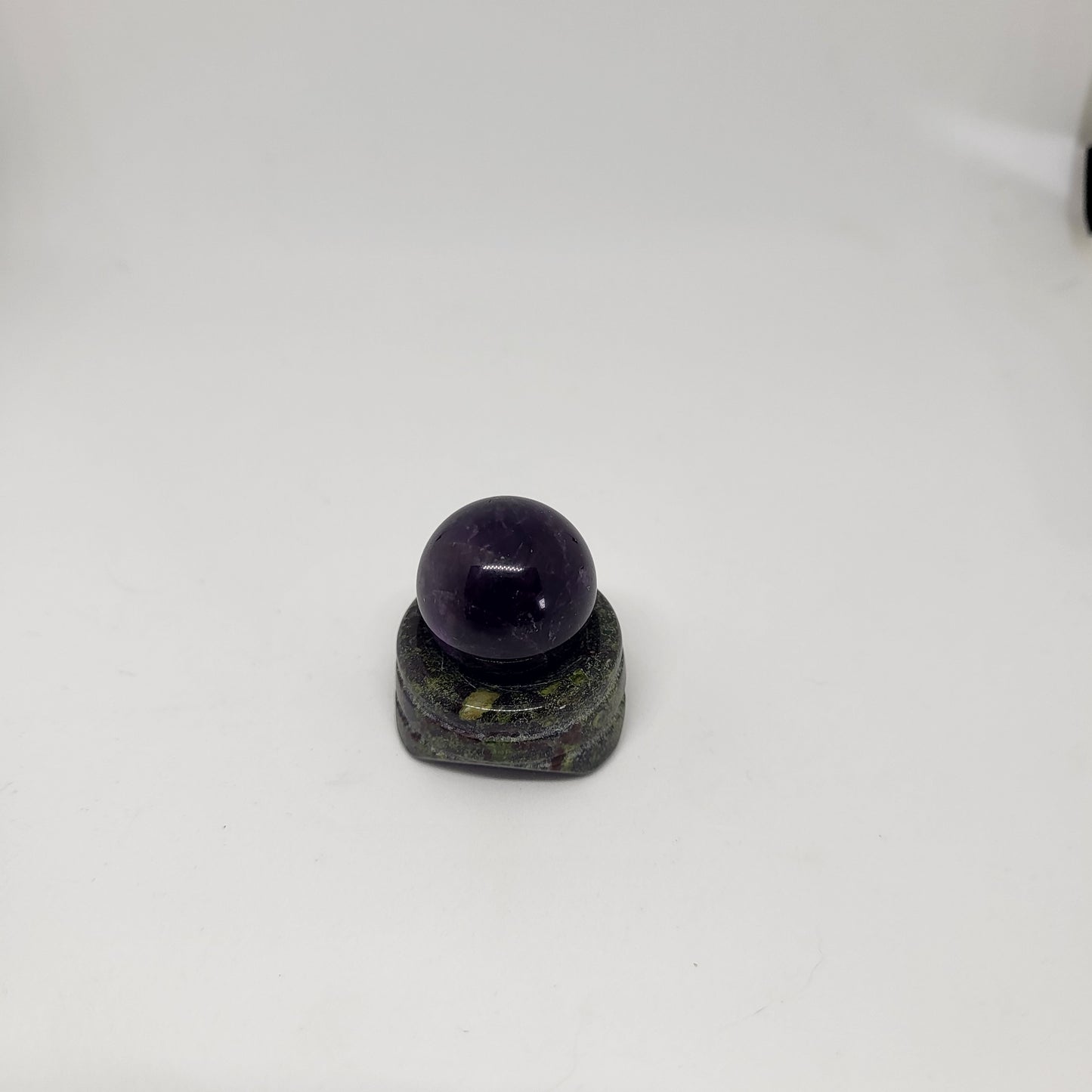 A Blood Jasper sphere stand with a spherical Dragon Blood Jasper on top, displayed against a white background.