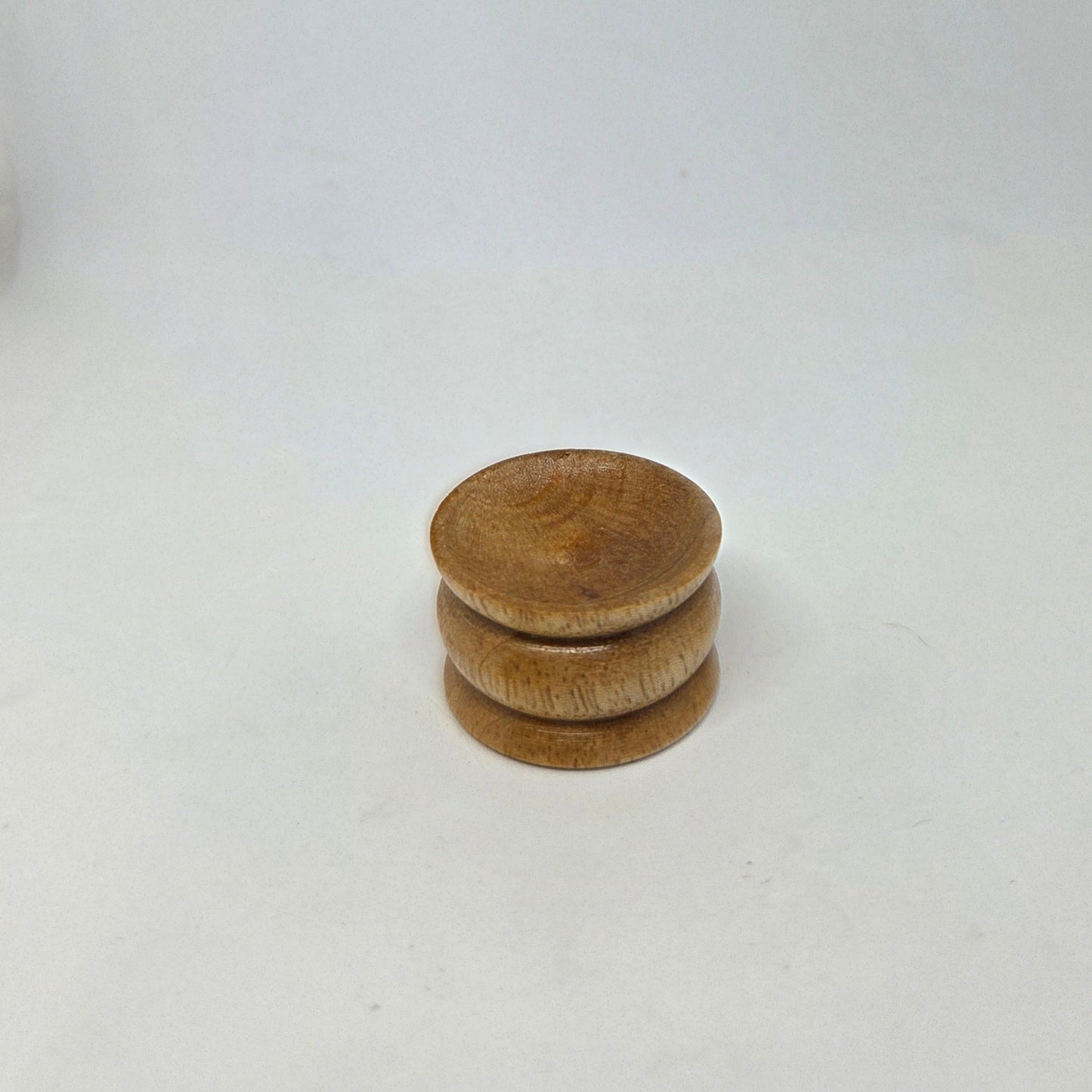 Stack of wooden coasters on a white background