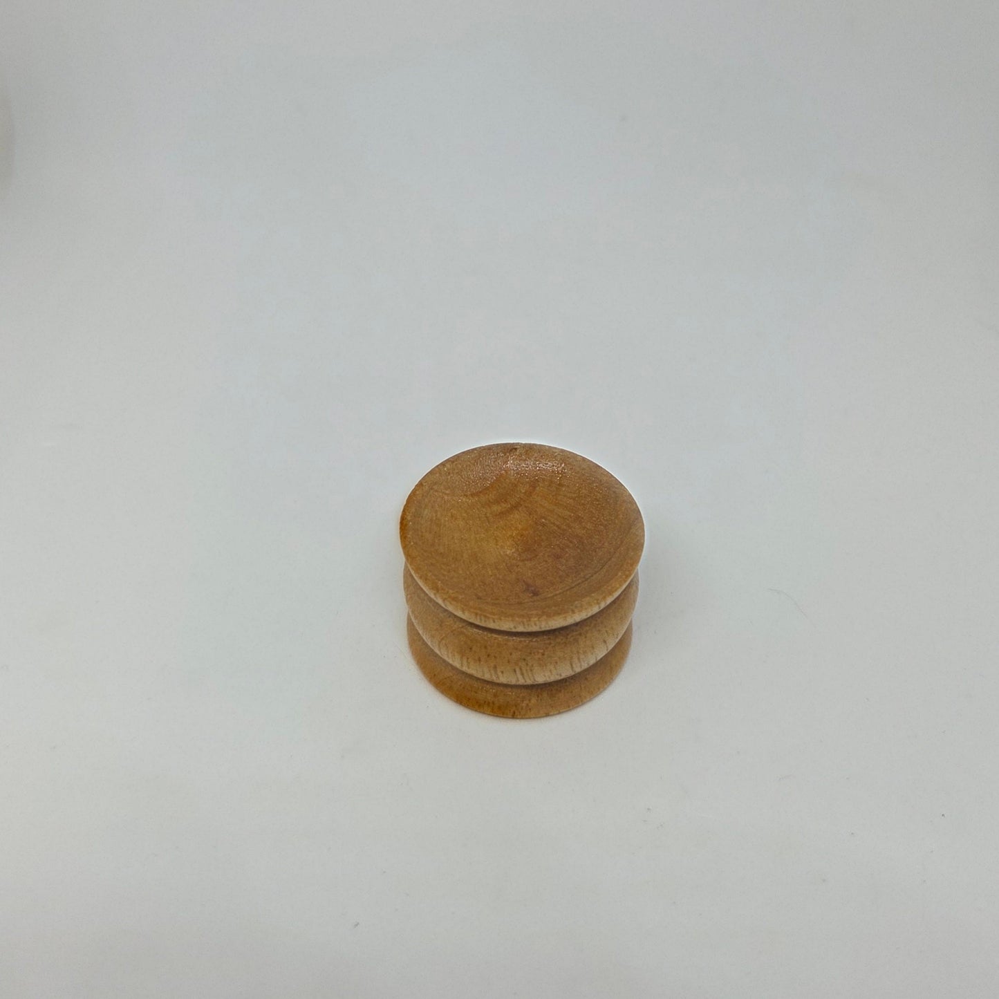 Stack of wooden discs on a white background