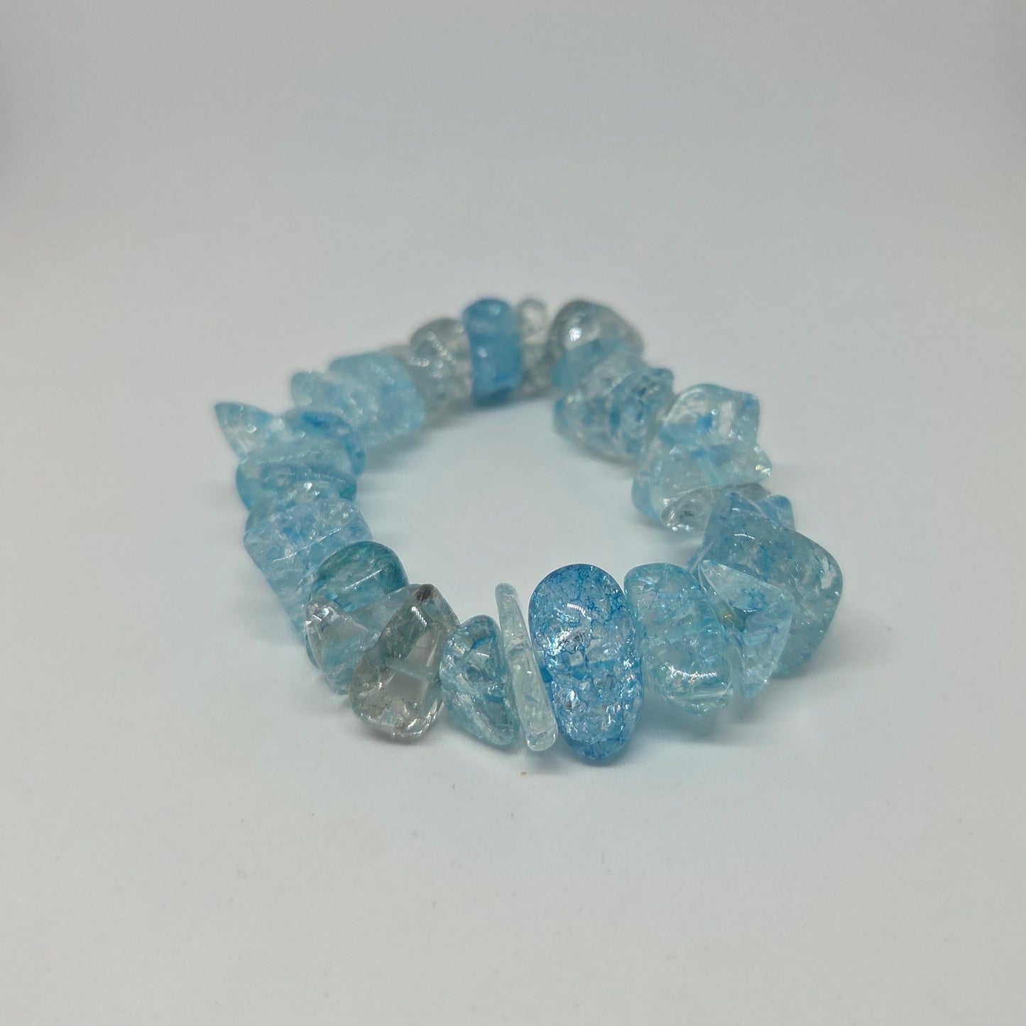 Blue beaded bracelet on a white background