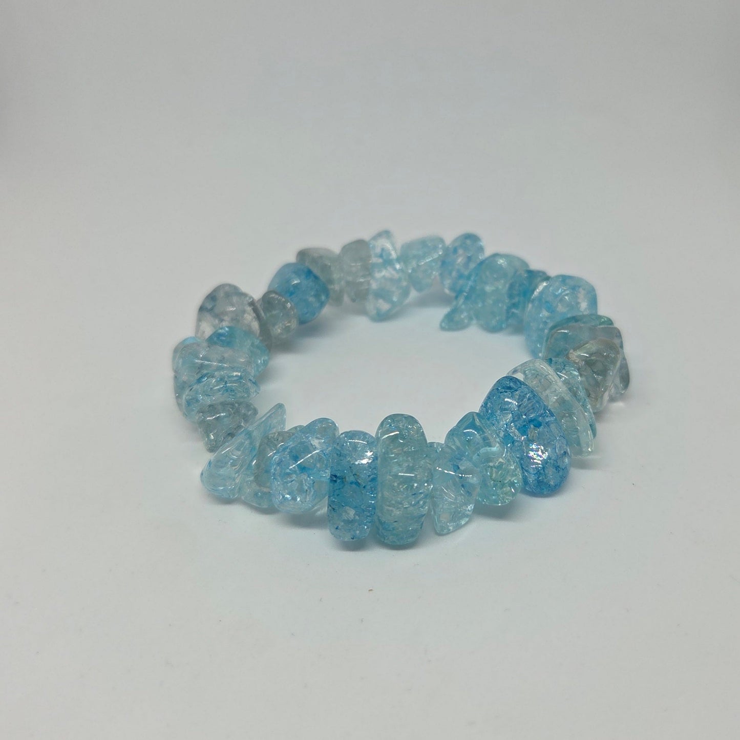 Blue crystal chip bracelet on a white background