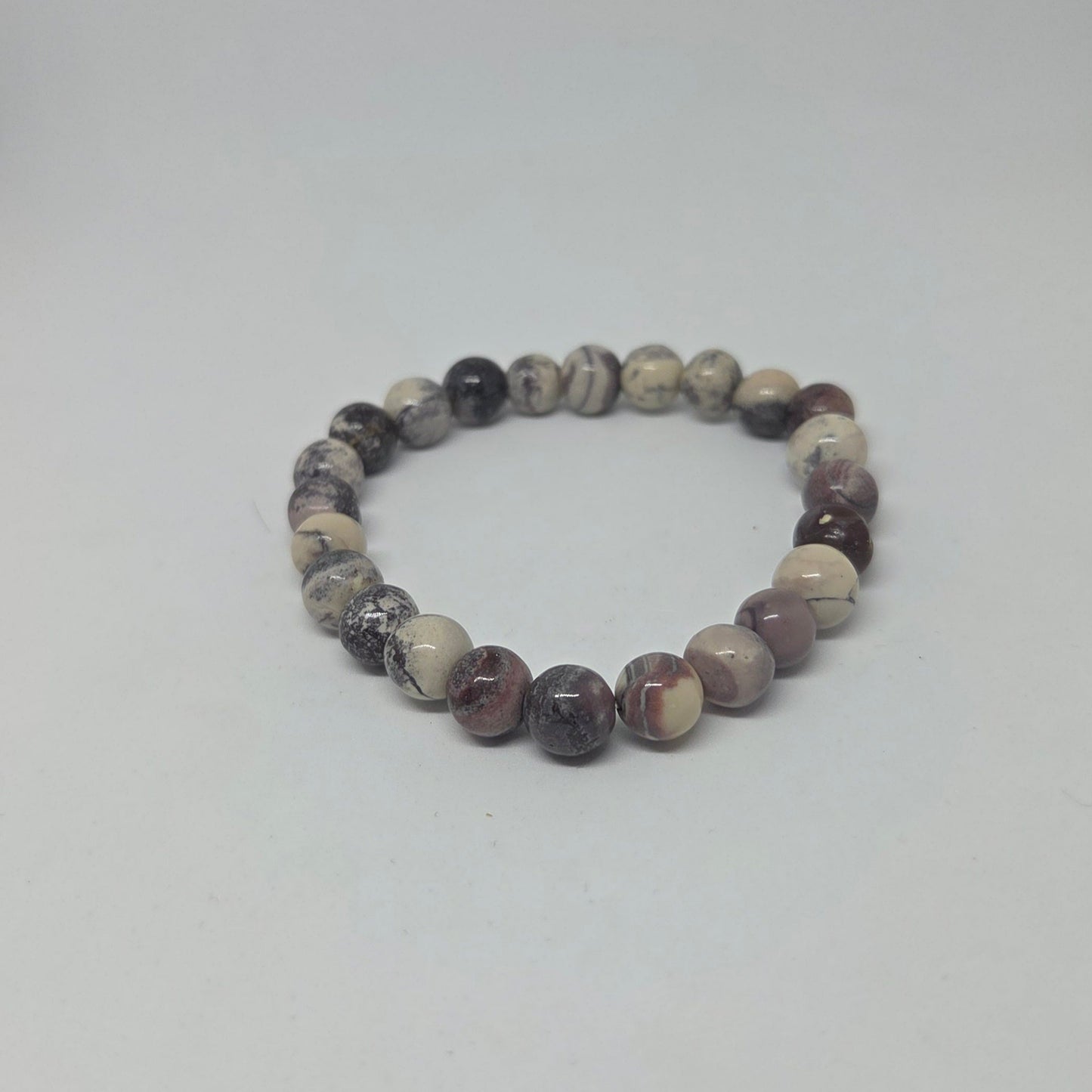 Beaded bracelet with multicolored beads on a white background