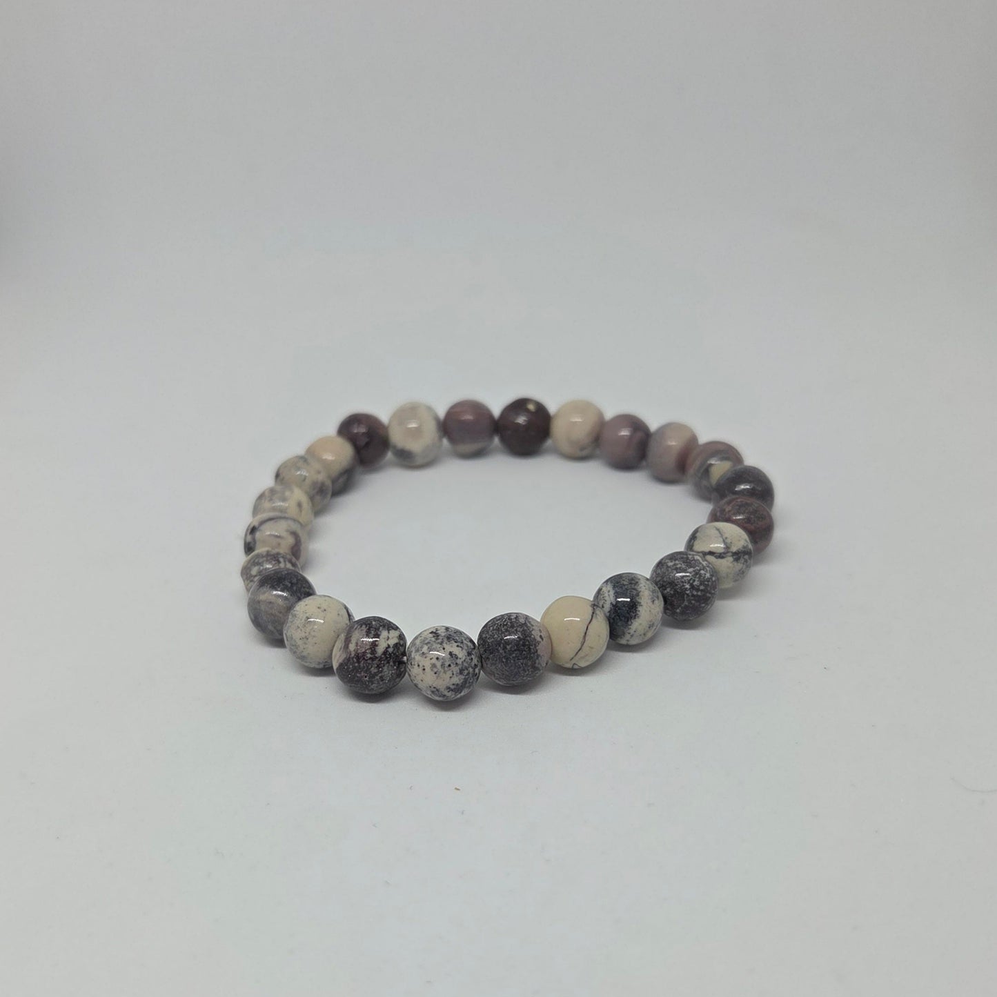Beaded bracelet with multicolor stones on a white background