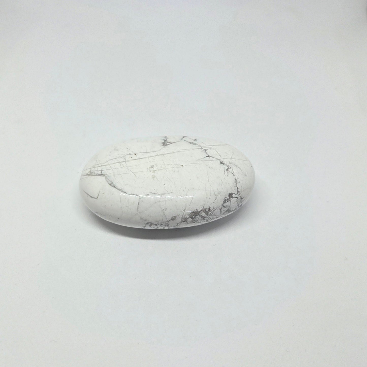 White marble stone on a light gray background