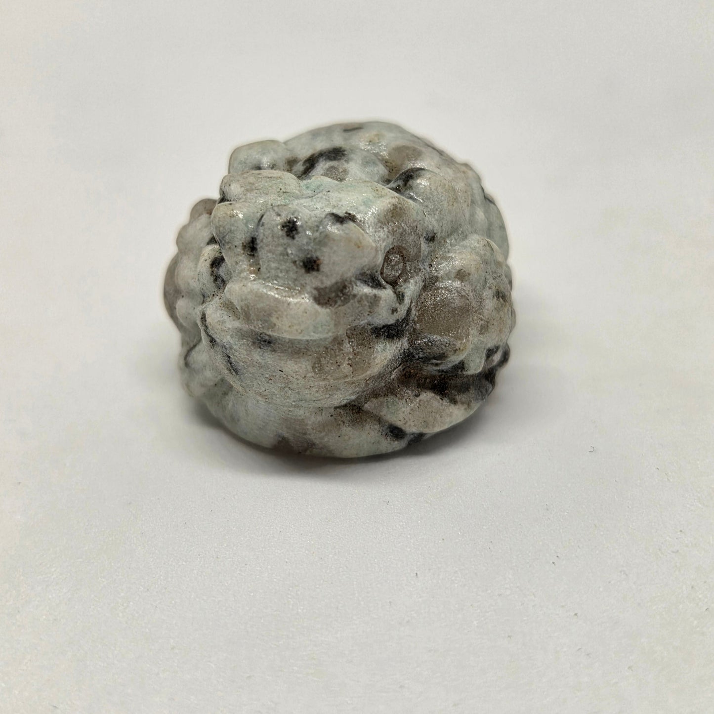 Decorative stone with a unique pattern on a white background