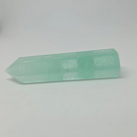 Green Fluorite Energy Crystal laying down, pointing to the left.