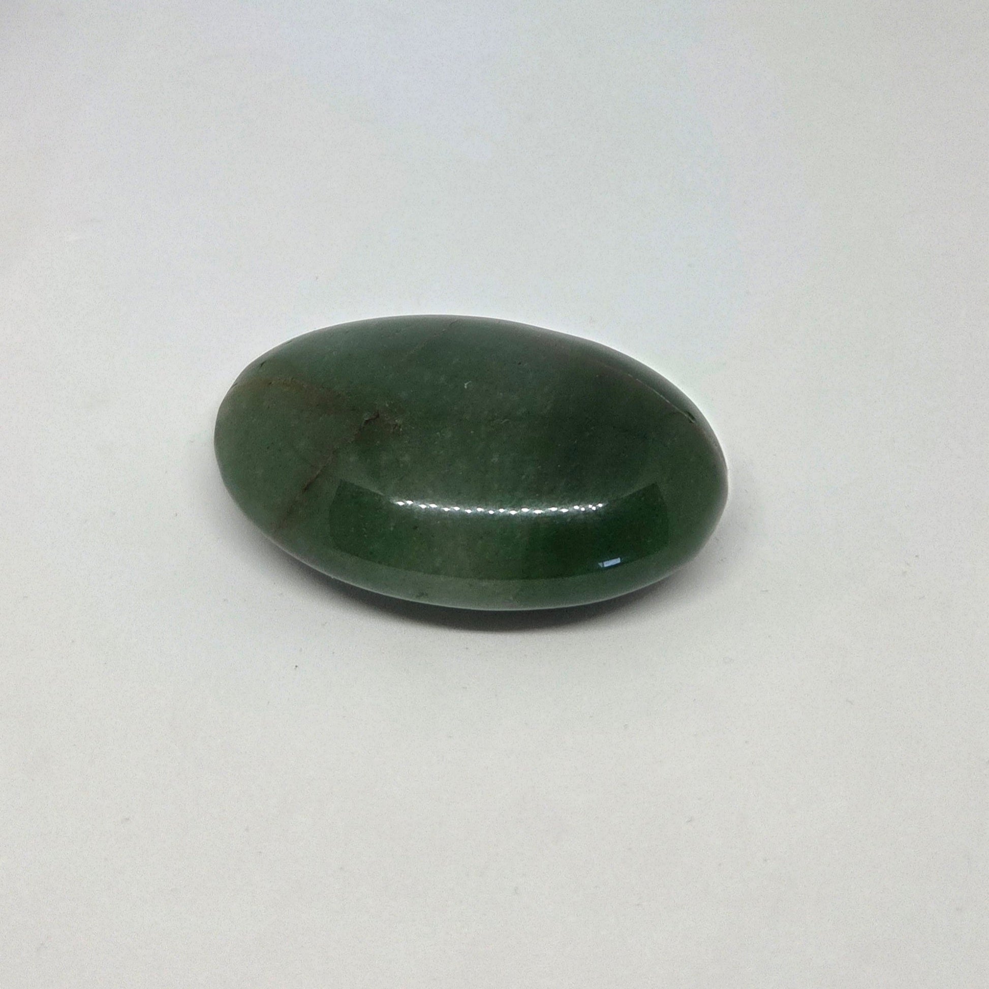 Green stone on a white background