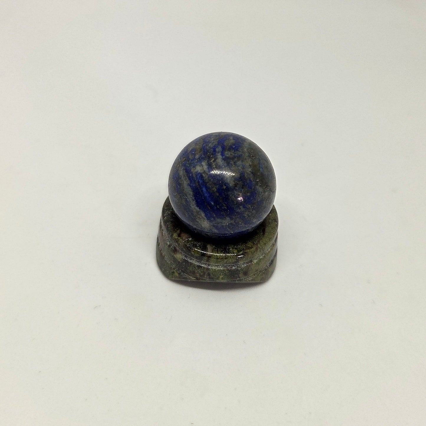Grey and BlueLapis_Lazuli_Energy Crystal Sphere foreward facing on a stand