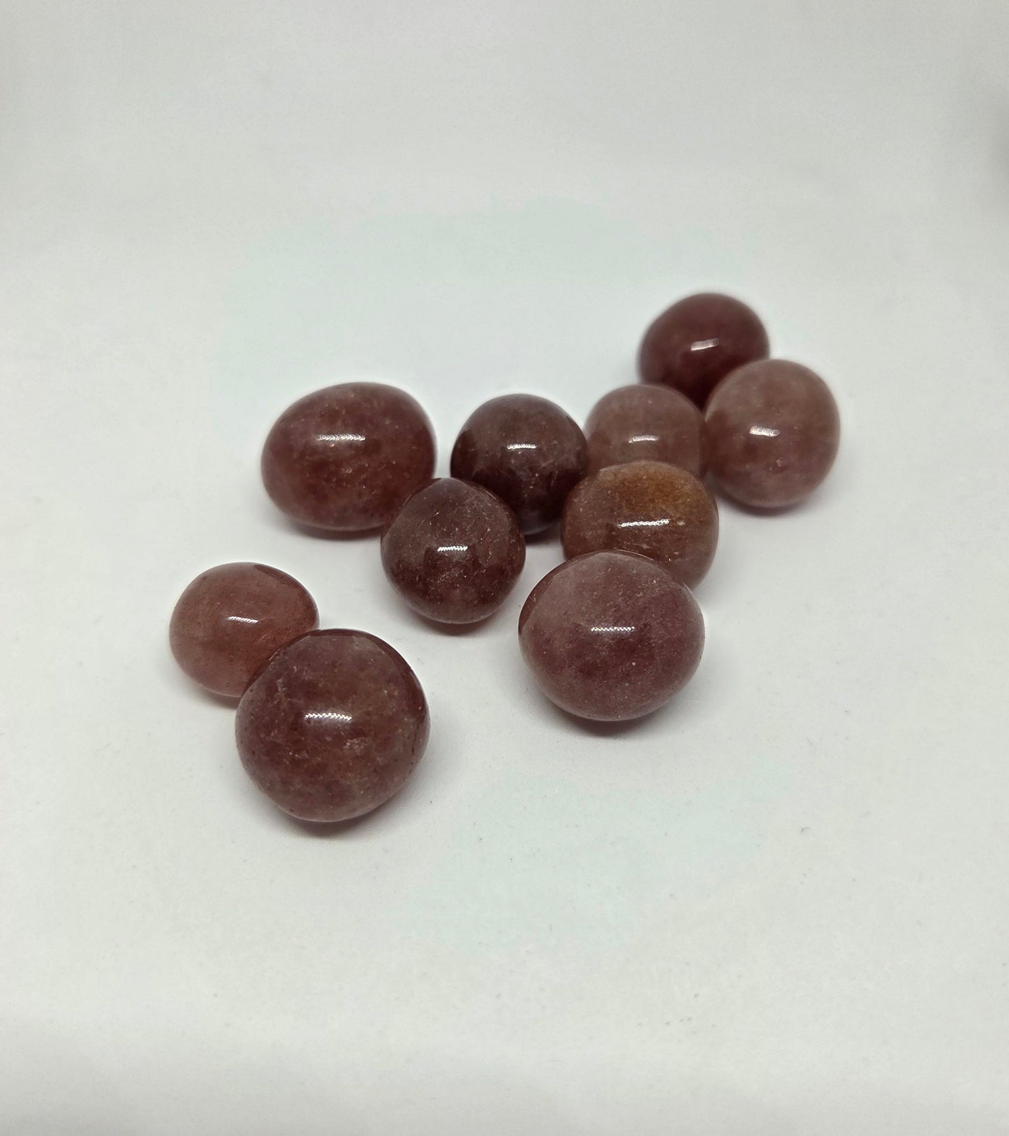 Strawberry Quartz Healing Stone grouped together at a slight angle pointing left