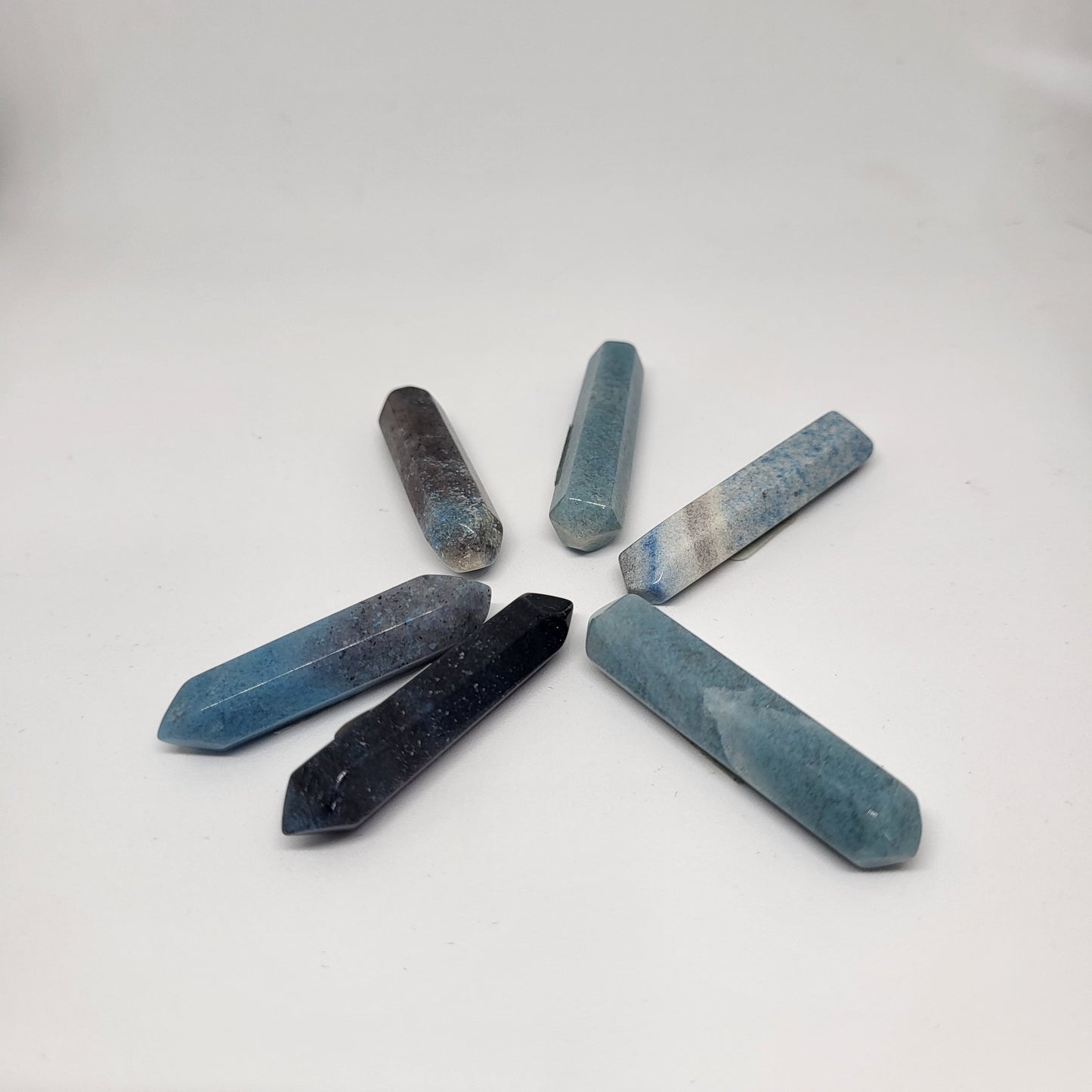 Trollite Crystal Energy Pillar with blue, green, gray, and purple colors assorted angles.