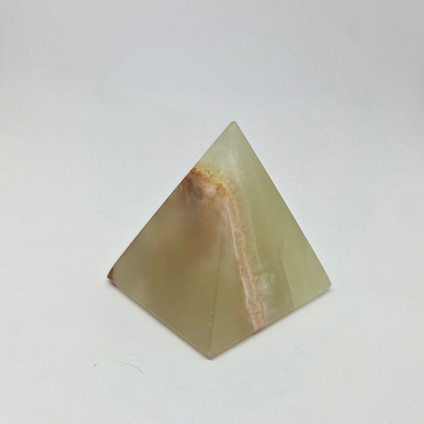 Pyramid-shaped stone on a white background