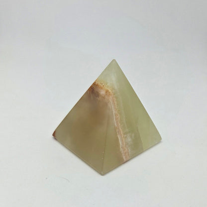 Pyramid-shaped stone on a white background