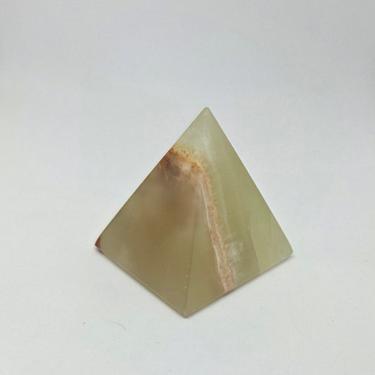 Pyramid-shaped stone on a white background