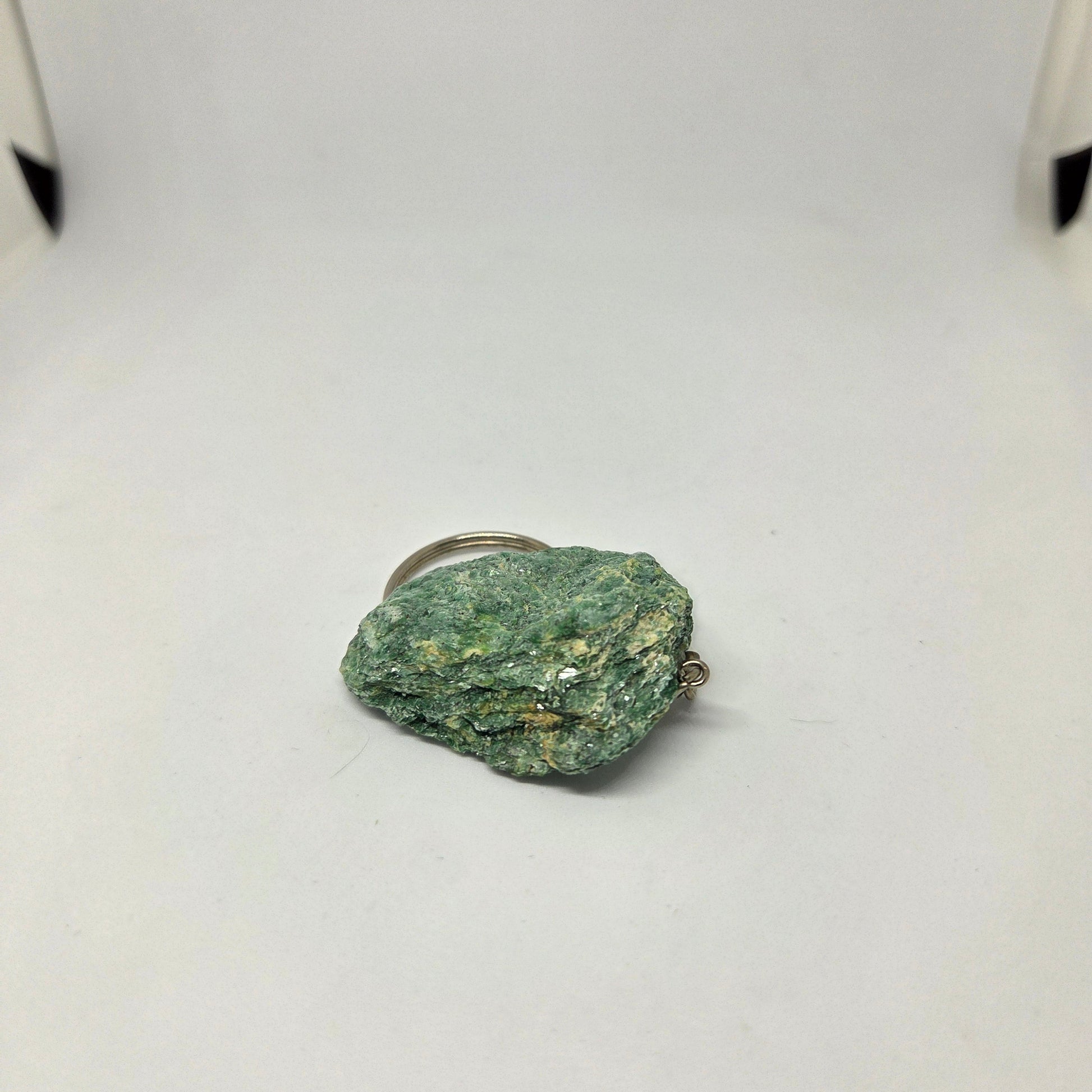 Green stone on a white background