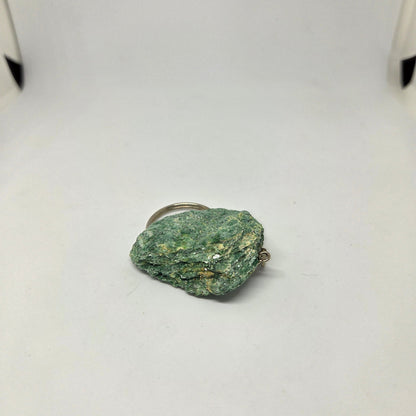 Green stone on a white background
