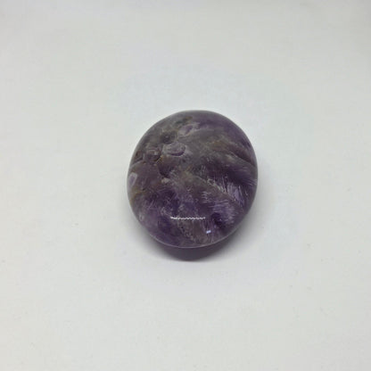 Purple stone on a white background