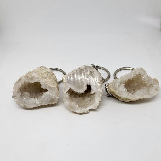 Three Quartz Geode keychains with silver metal clasps, displayed against a white background.
