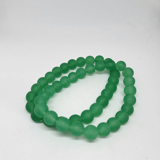 A green aventurine bracelet with 8mm round beads, displayed against a white background.