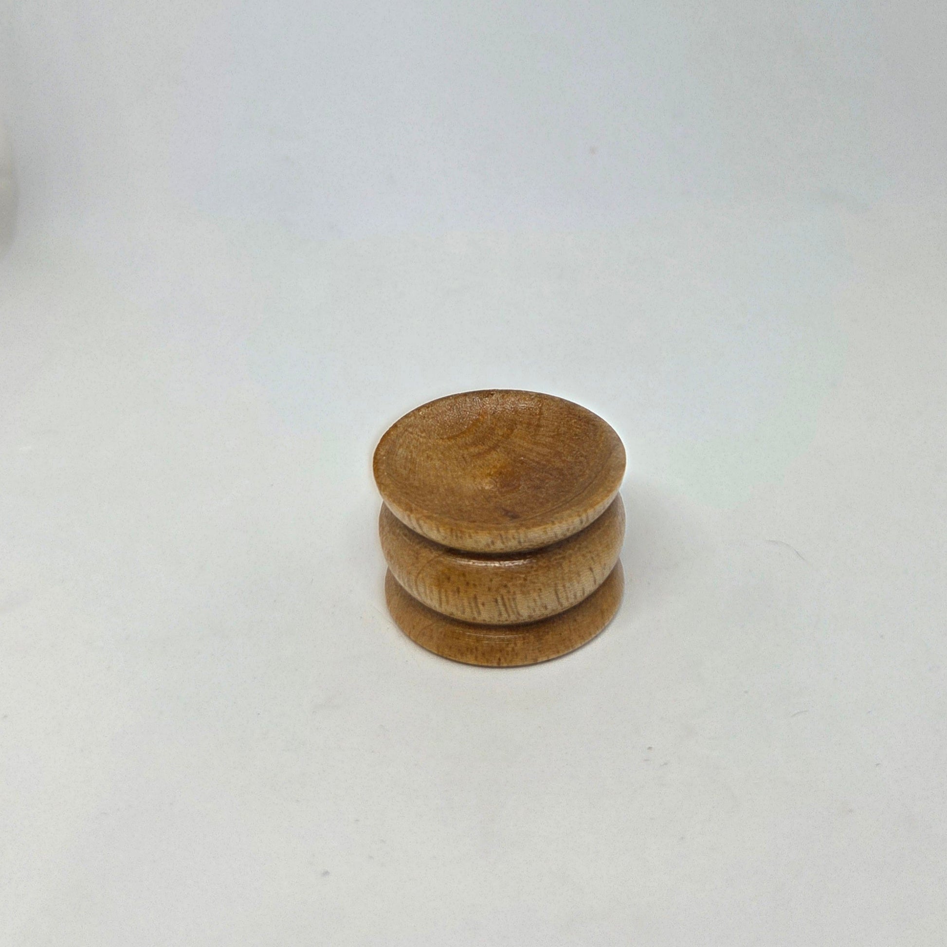 Stack of wooden coasters on a white background
