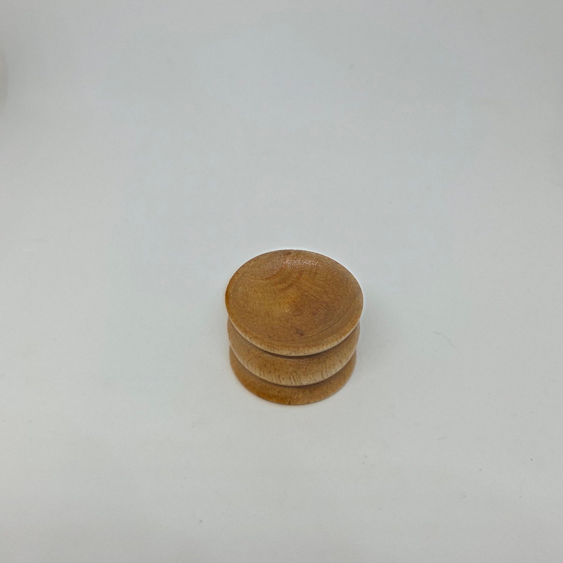Stack of wooden discs on a white background