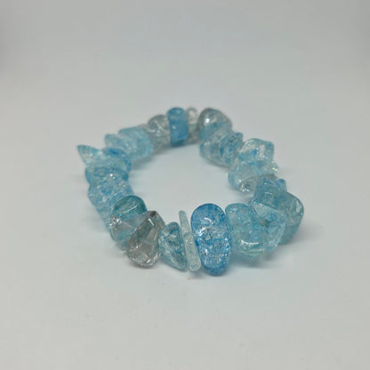 Blue beaded bracelet on a white background