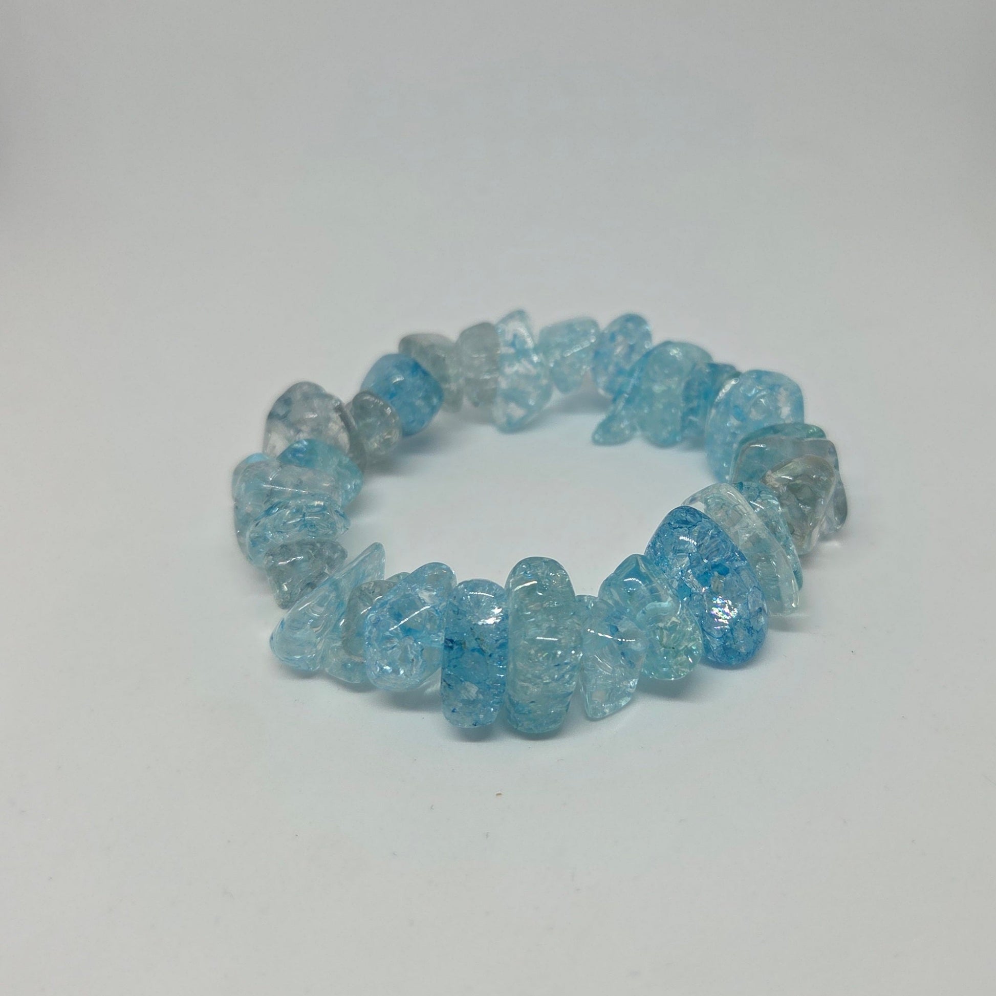 Blue crystal chip bracelet on a white background