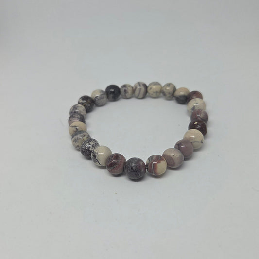 Beaded bracelet with multicolored beads on a white background