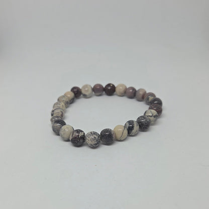 Beaded bracelet with multicolor stones on a white background