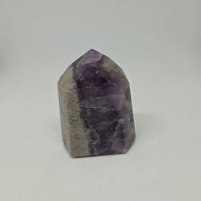 Amethyst crystal on a white background