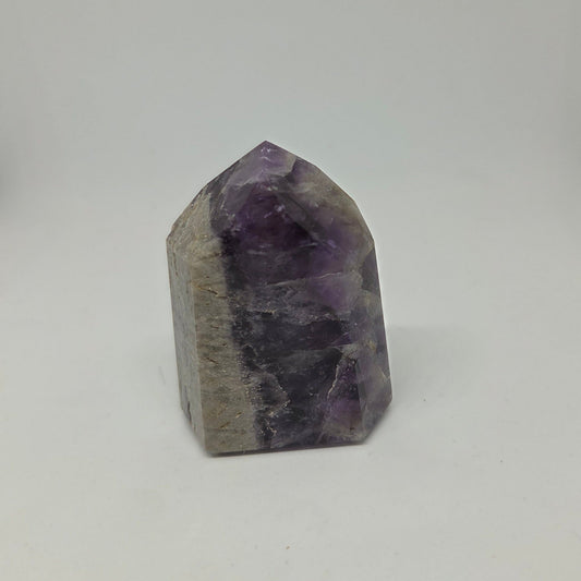 Amethyst crystal on a white background