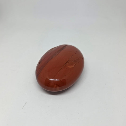 Brown stone with striped pattern on a white background