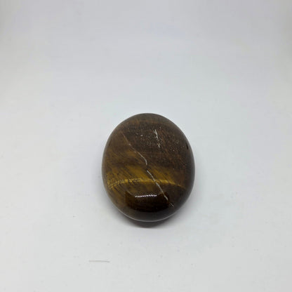 Oval-shaped brown stone on a white background