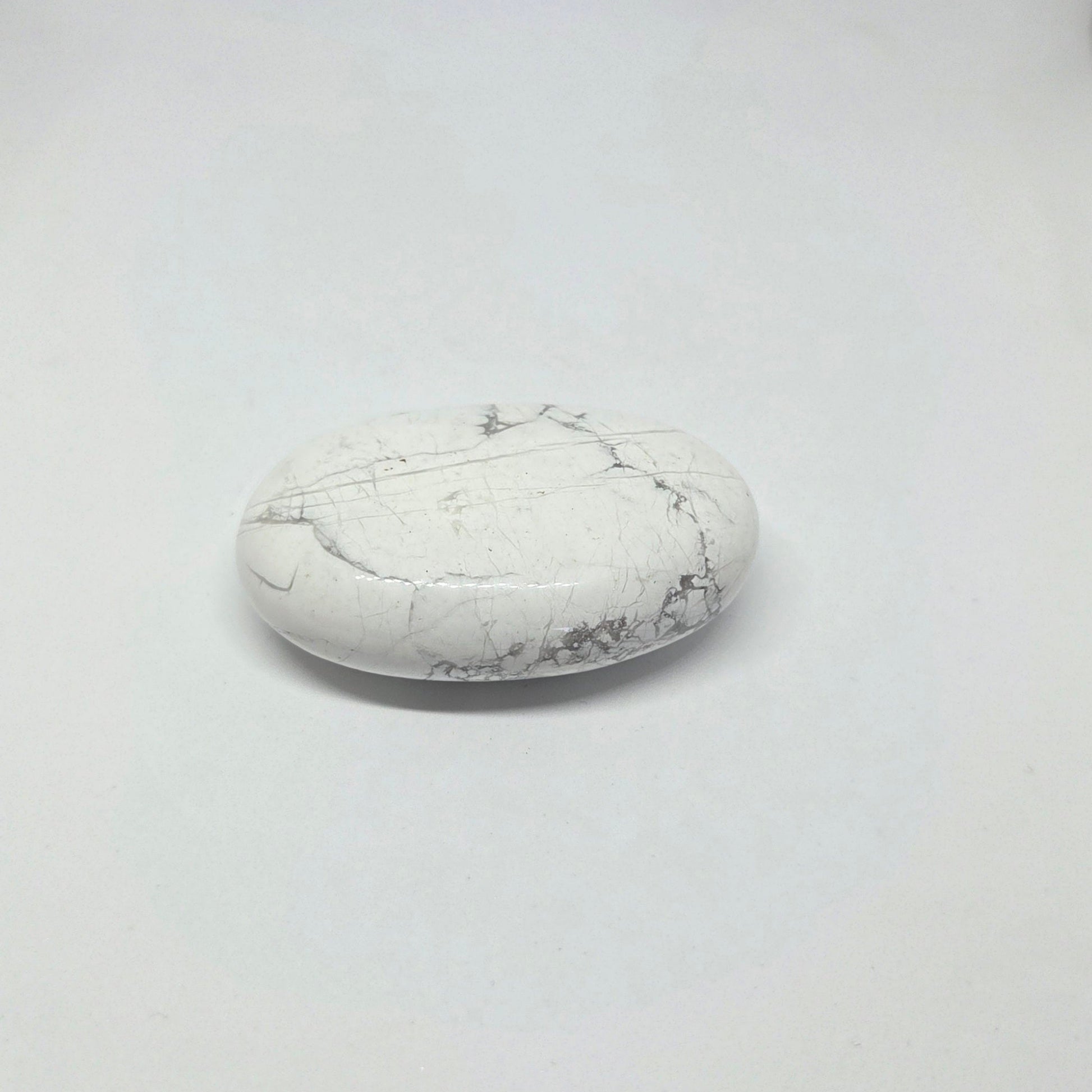 White marble stone on a light gray background