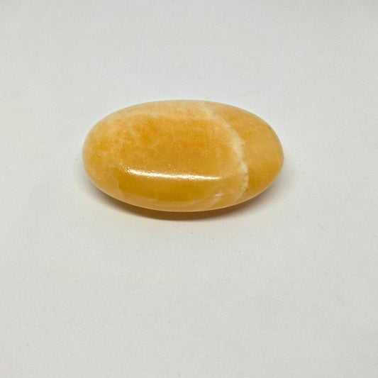Yellow stone on a white background