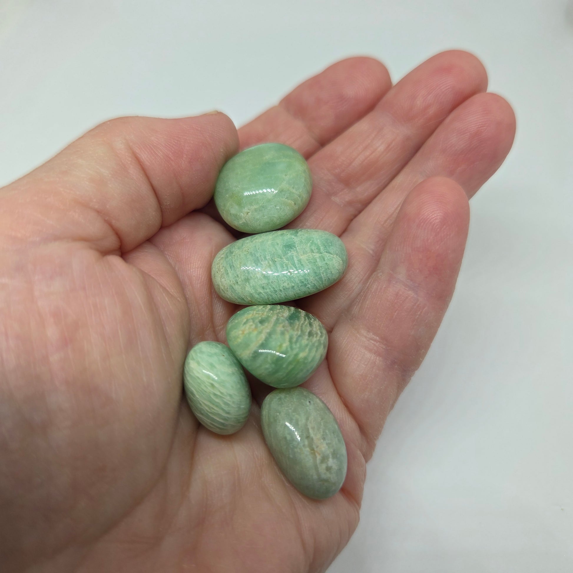 Amazonite Healing Stone Tumble, in a hand