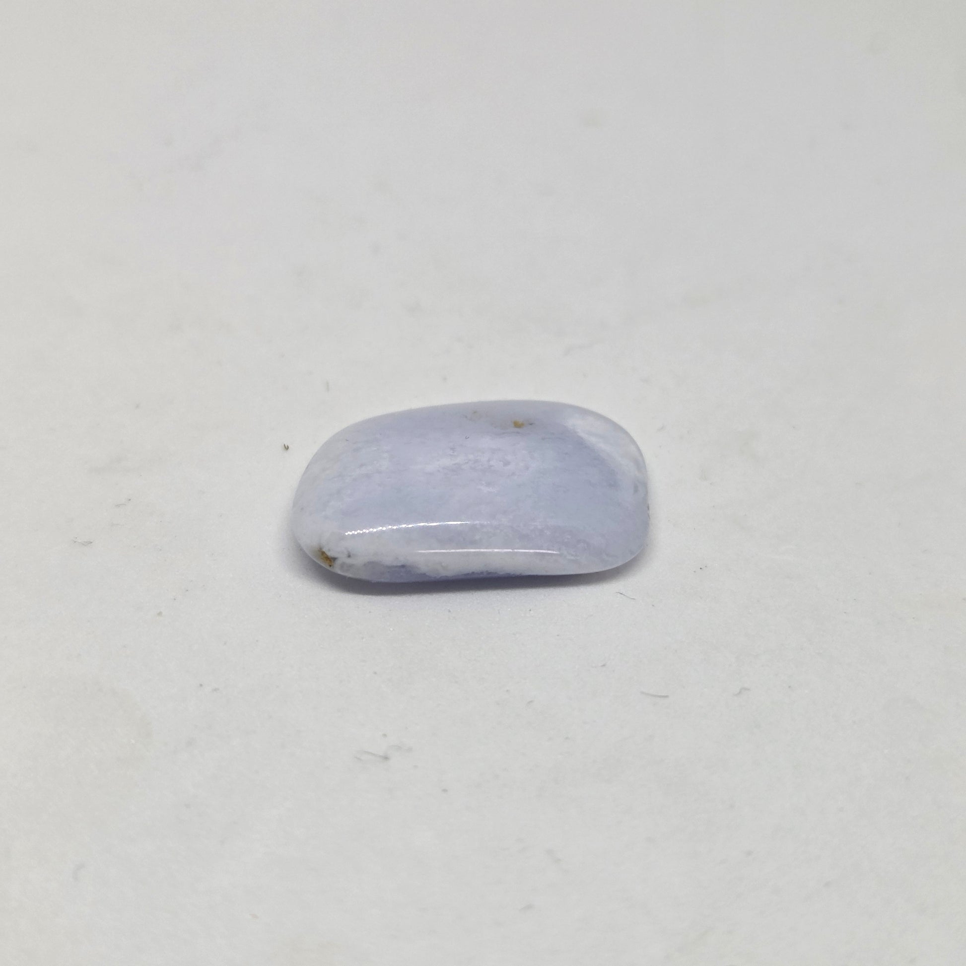 Polished Blue Laced Agate Healing Crystal close up laying flat