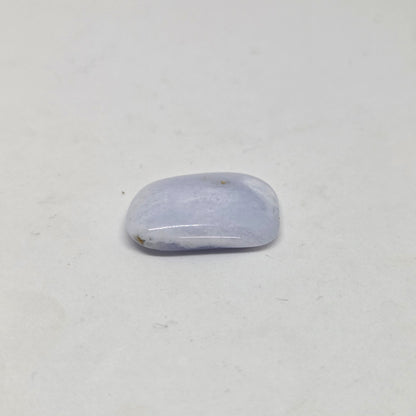 Polished Blue Laced Agate Healing Crystal close up laying flat