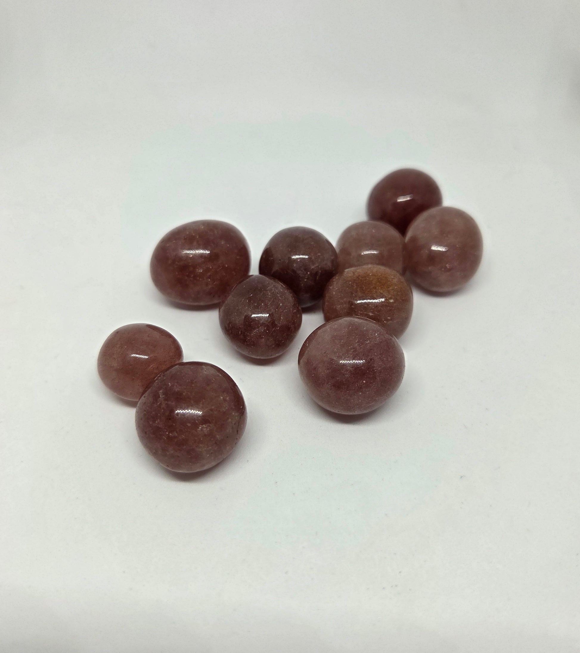 Strawberry Quartz Healing Stone grouped together at a slight angle pointing left
