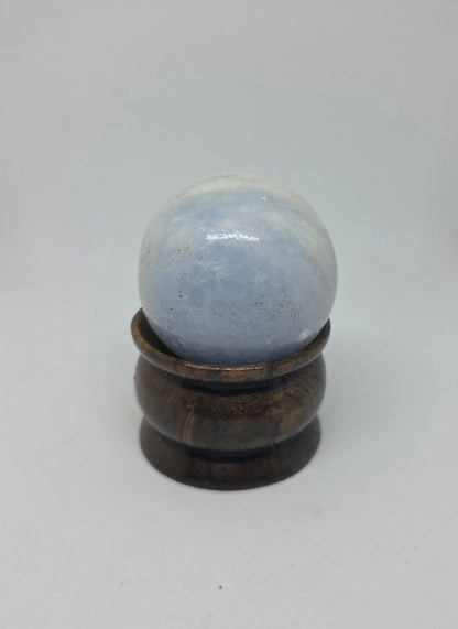 Blue Calcite Sphere Showing Natural Black Mineral Inclusions