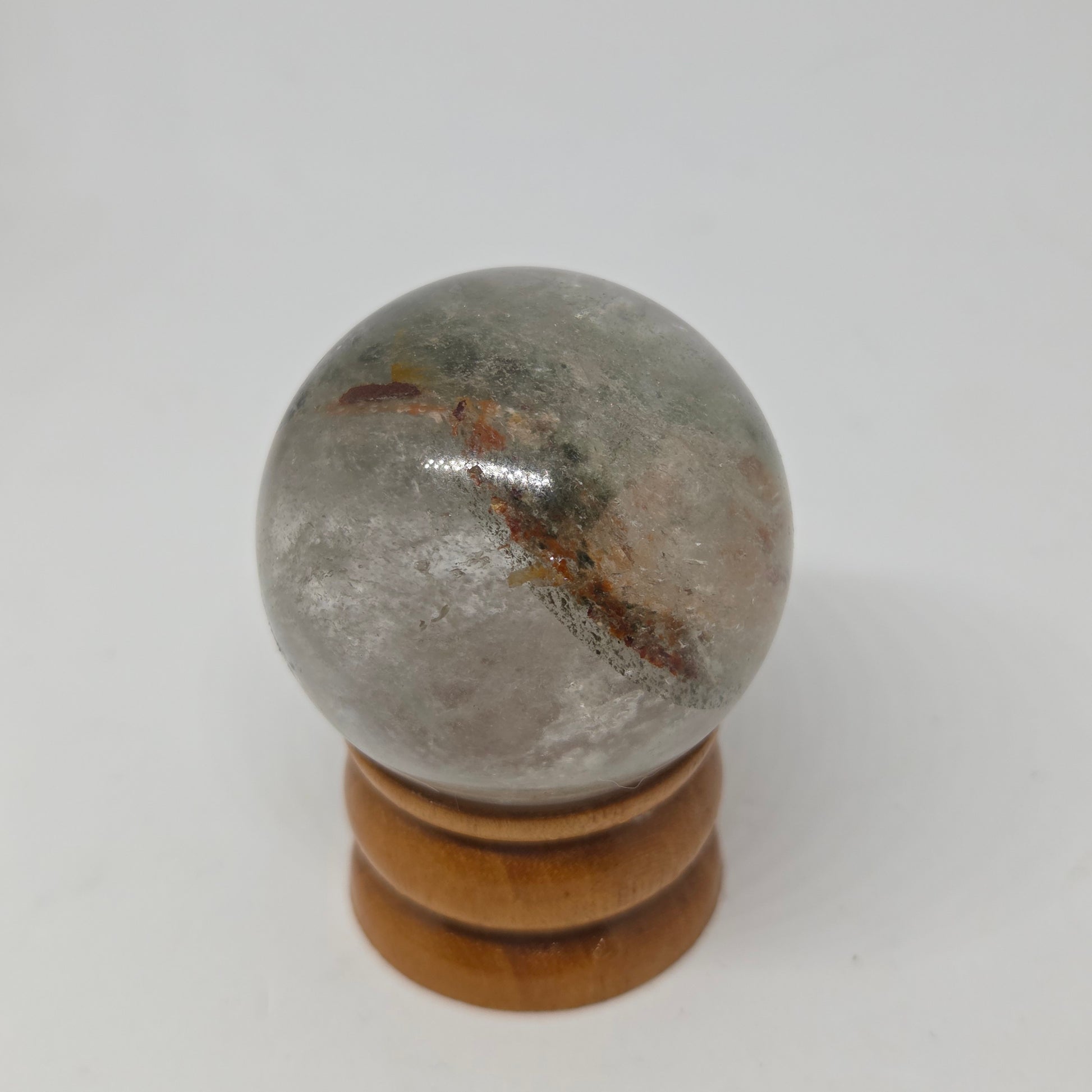Lodolite Sphere Side View with Natural Grey Amber Inclusions